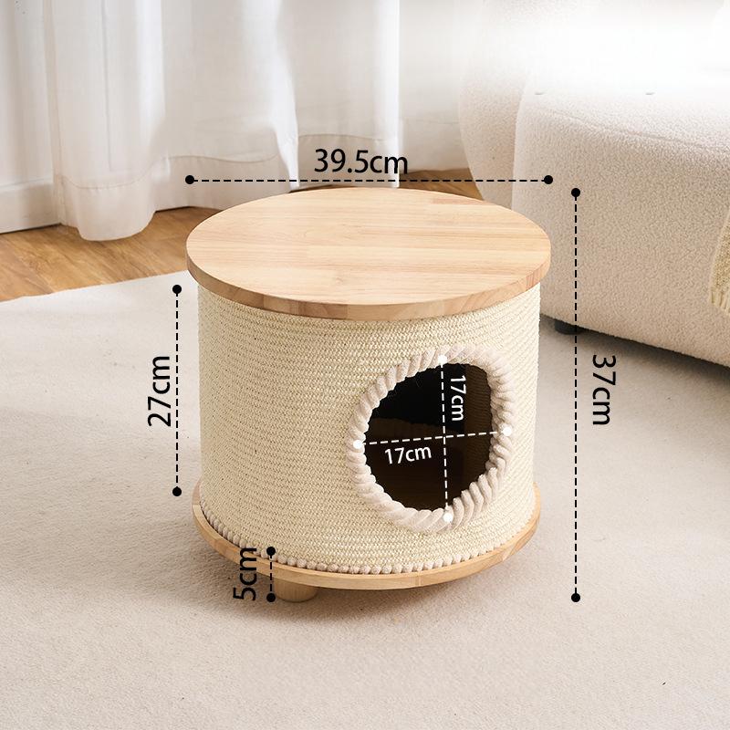 A cylindrical desk or cat playhouse with a light wood top and base, wrapped in cream woven rope, shown in a softly styled room. Black dashed lines and text display the dimensions: 39.