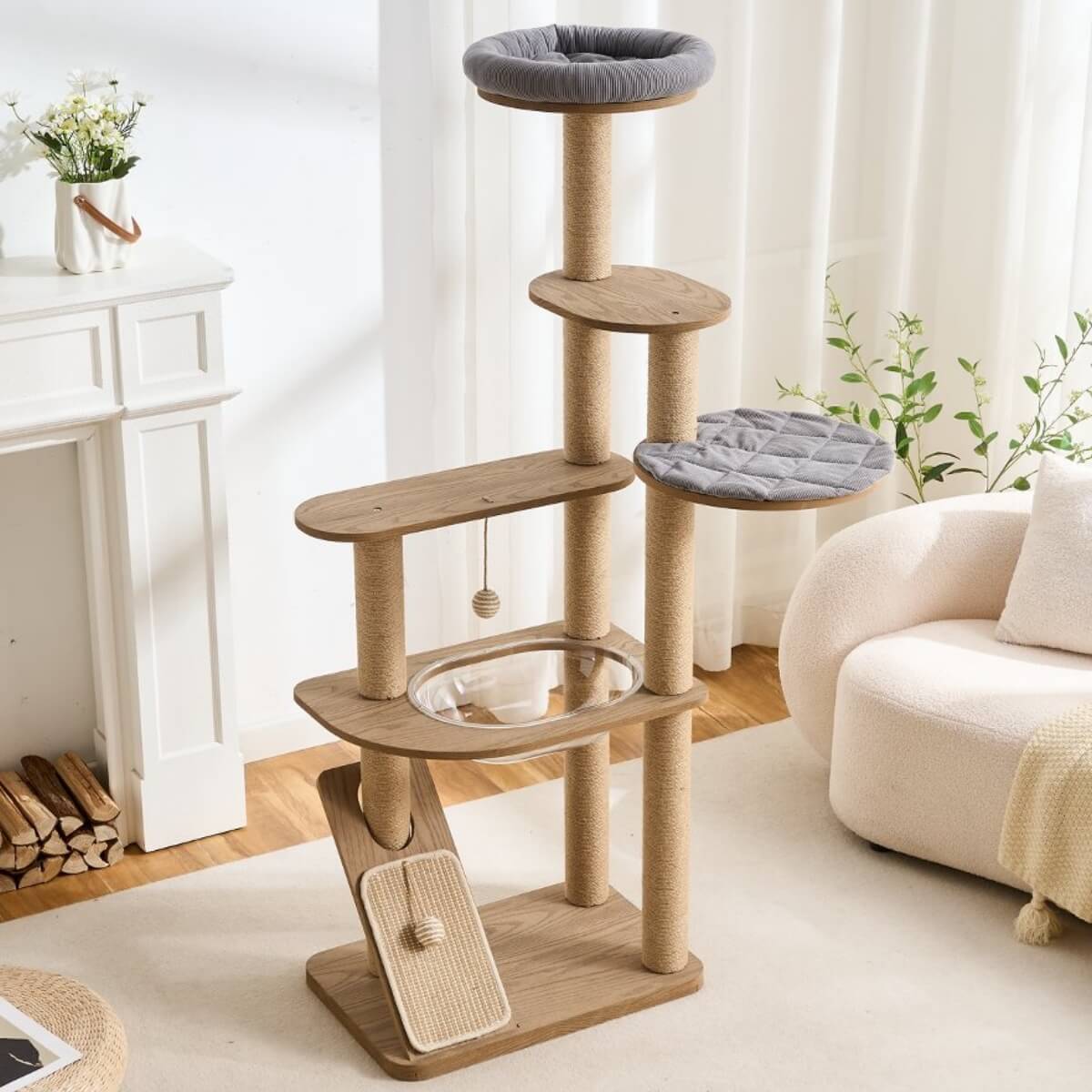 Cat tree with multiple platforms and a scratching post in a living room setting.