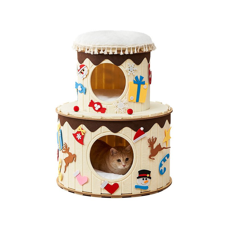 Two-tiered cat playhouse with festive decorations on a white background