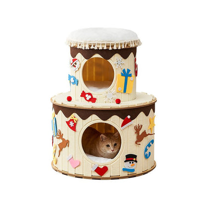 Two-tiered cat playhouse with festive decorations on a white background