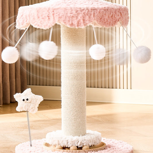 Carousel Cat tree with pink top and white balls on a wooden floor.