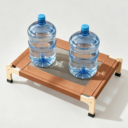 Two buckets of water are placed on a wooden elevated cat bed to demonstrate its weight-bearing capacity. The photo was taken against a simple, light gray studio backdrop.