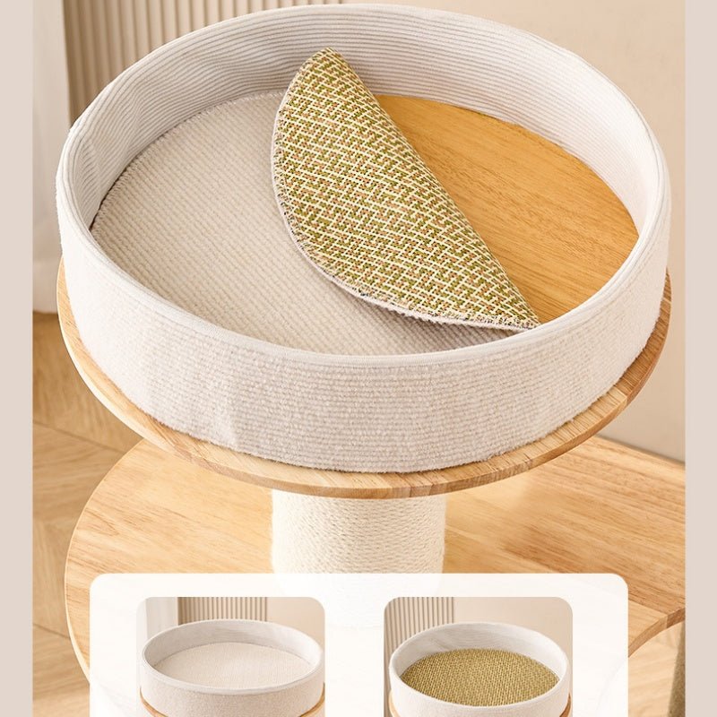 A round, durable cat perch seat with a light beige fabric-wrapped rim, a light wood platform, and a folded cream cushion with a gold woven texture. The main product is shown in a styled indoor setting, with two small inset images at the bottom showing close-ups of the cushion and interior.