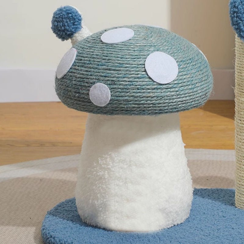 Mushroom-shaped cat post with blue and white polka dots on a wooden floor.