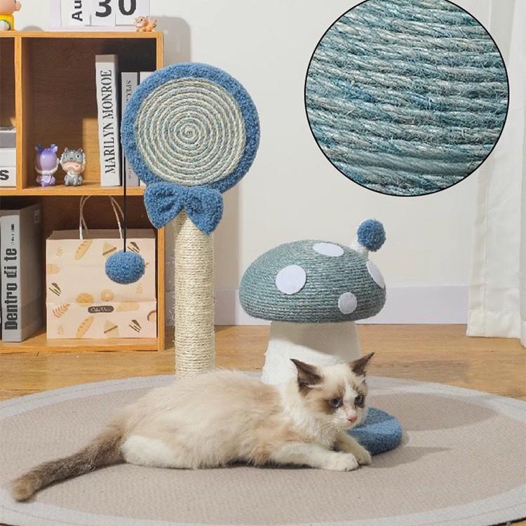 Cat playing with a mushroom-shaped sisal post on a wooden floor.