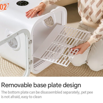 Person interacting with a pet dryer box, highlighting a removable base plate design.