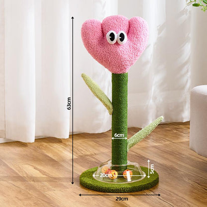 Pink flower-shaped cat post with green stem and measurements on a wooden floor.