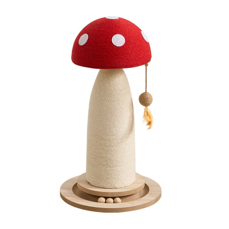 A red mushroom cat scratching post with a red woven cap, white polka dots, a beige wrapped shaft, and a round wooden base, shown on a plain white background.