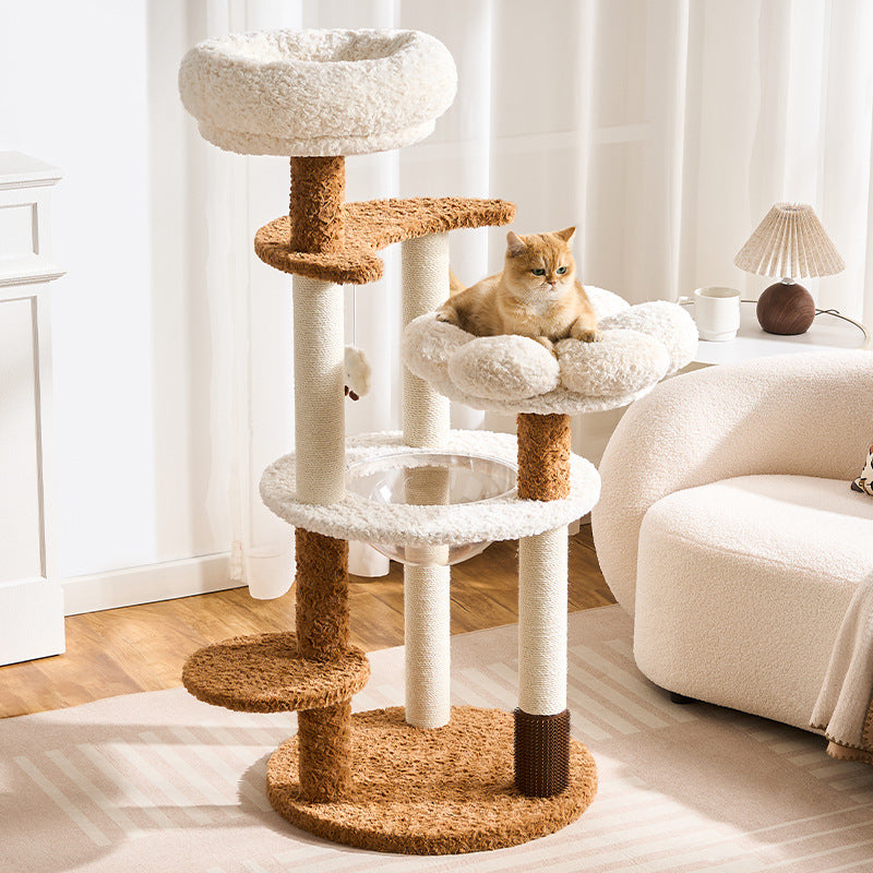 Cat tree with multiple levels and a cat sitting on one of the platforms in a living room.