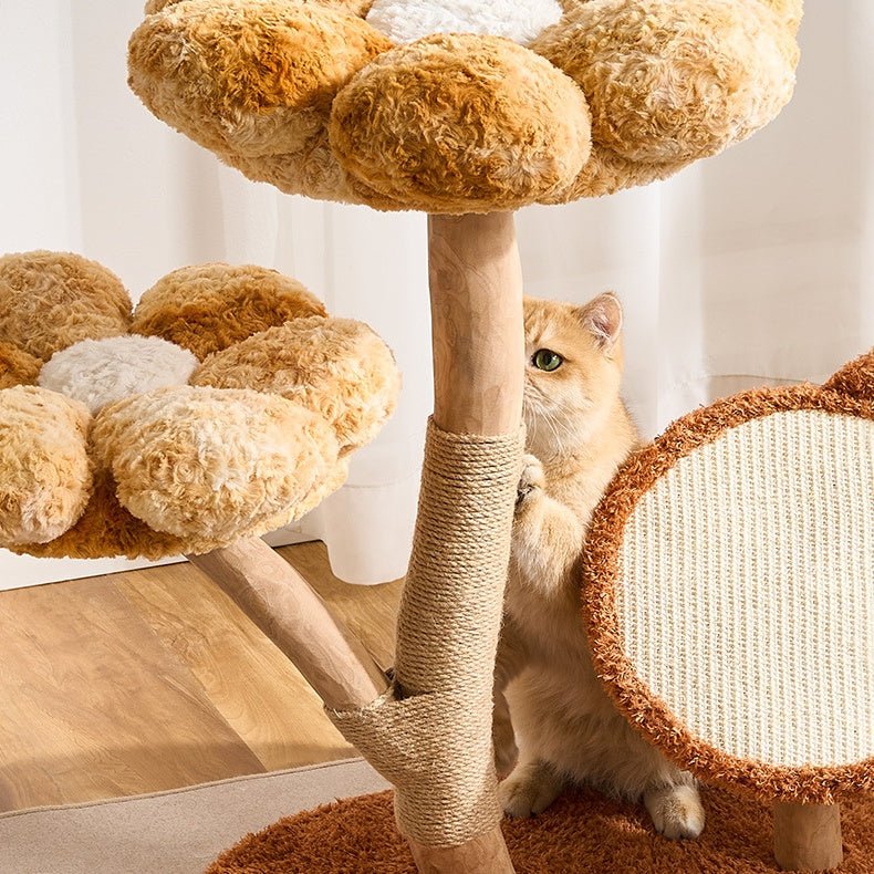Cat climbing a real wood cat tree and sisal-wrapped posts.