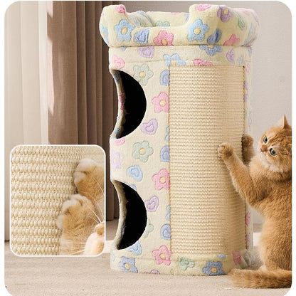 A tall cylindrical cat tower with a cream-colored floral fabric top and sides, a beige sisal-wrapped scratching panel, and two black cat holes. An orange cat is shown interacting with the tower, with a close-up inset of the cat's paws on the sisal texture.