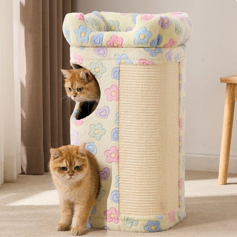 A cream-colored cat tree with a pastel floral pattern and a vertical scratching panel, shown in a home setting with two orange tabby cats interacting with it.